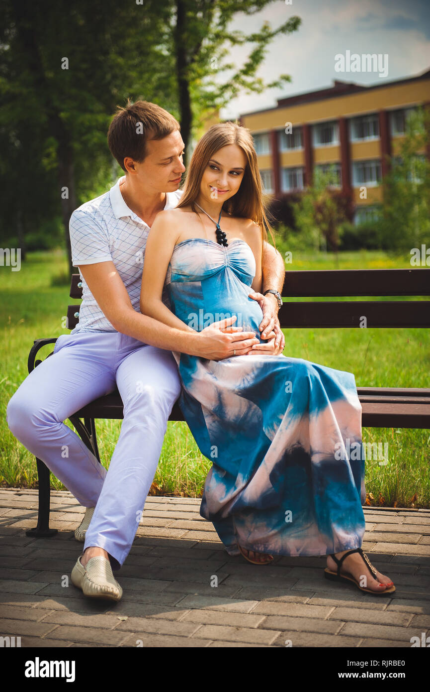 Happy pregnant Couple in the summer park Stock Photo - Alamy