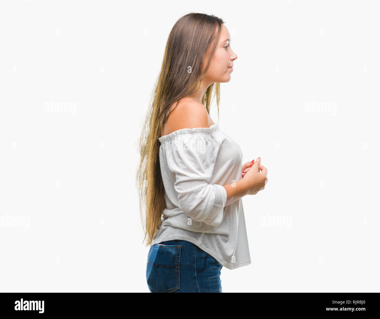 Young caucasian beautiful woman over isolated background looking to ...