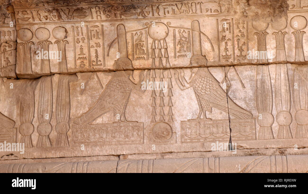 God OSIRIS as a bird, painted, carved stone relief from the Temple of Hathor, Dendera, Egypt Stock Photo