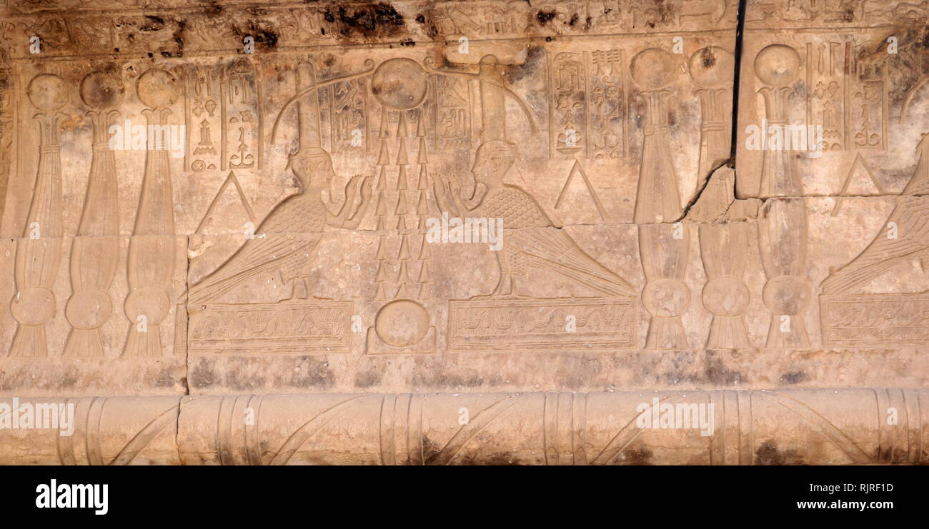 God Osiris as a bird; carved stone relief from the Temple of Hathor, Dendera, Egypt Stock Photo