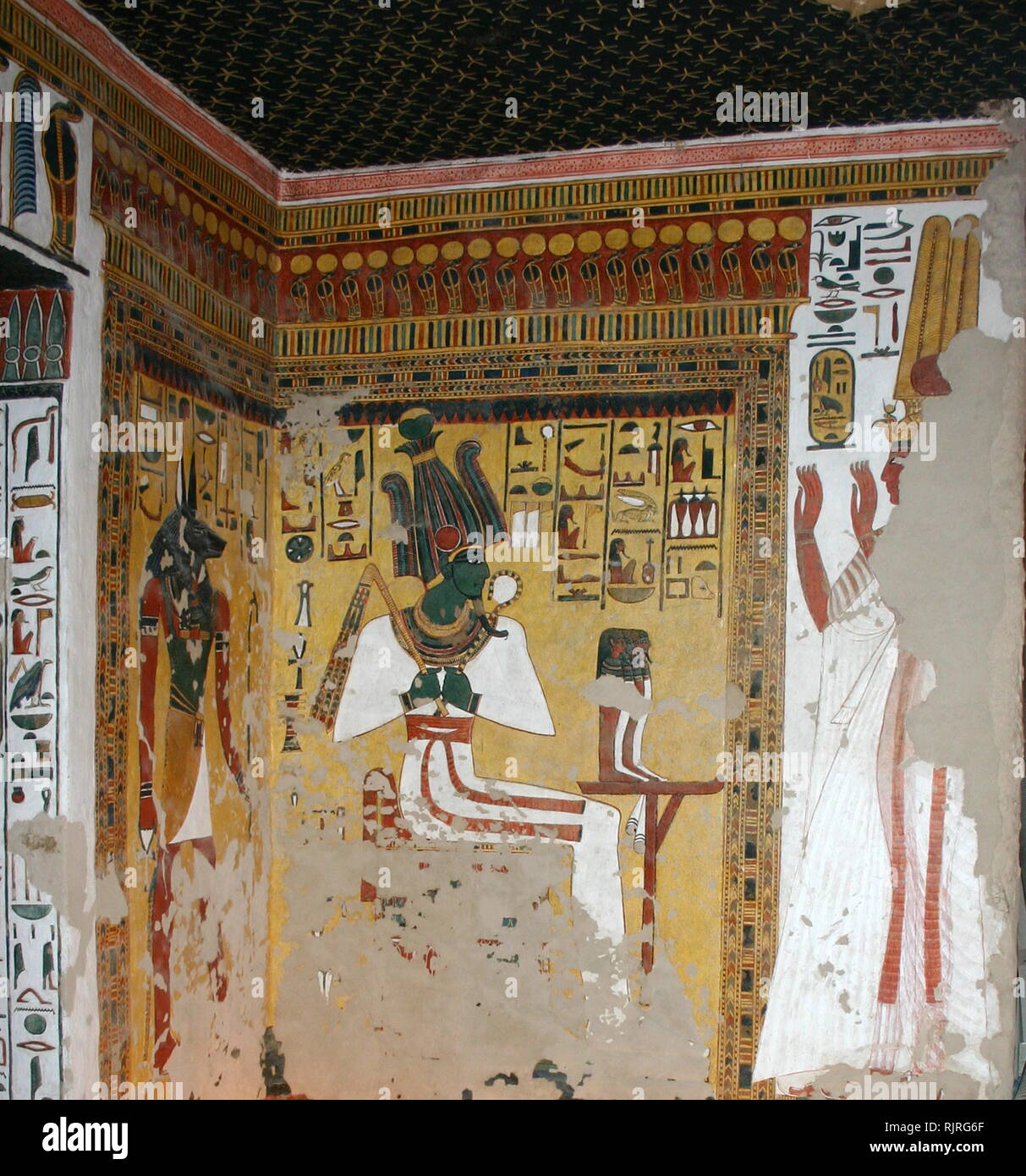 The God Osiris depicted in a wall Painting, Inside the tomb (QV66) of Nefertari, in Egypt's Valley of the Queens. It was discovered by Ernesto Schiaparelli in 1904. It is called the Sistine Chapel of Ancient Egypt. In the Valley of the Queens, Nefertari's tomb once held the mummified body and representative symbolisms of her, like what most Egyptian tombs consisted of. Now, everything had been looted except for two thirds of the 5,200 square feet of wall paintings. ca. 1255 BC Stock Photo