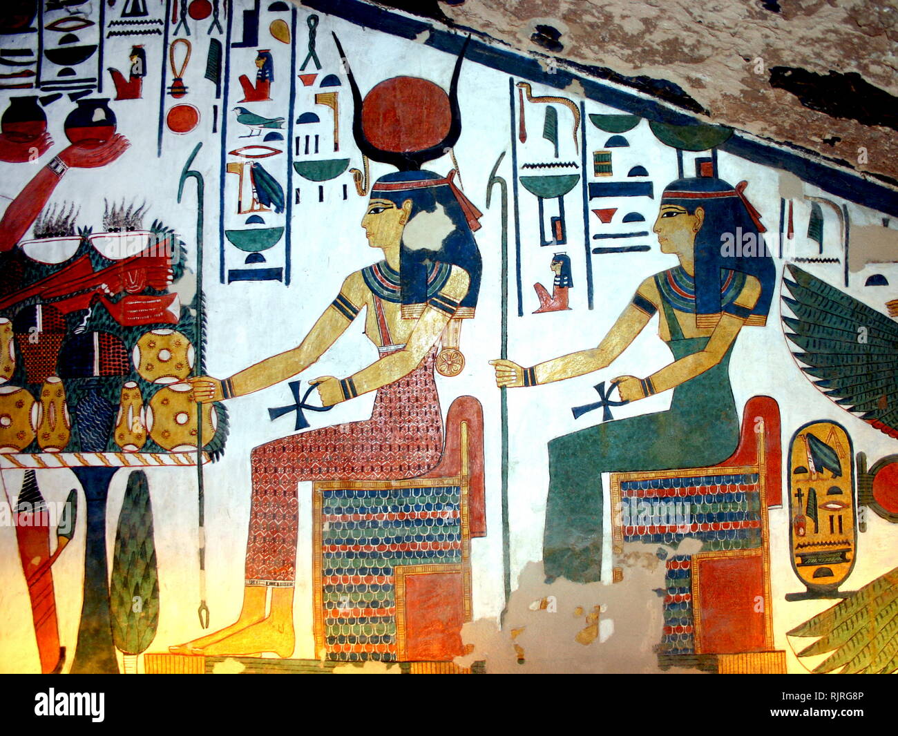 Wall Painting depicting, the Goddess Isis with Nefertari, Great Wife of  Pharaoh Ramesses II, Inside the tomb (QV66) of Nefertari, in Egypt's Valley  of the Queens. It was discovered by Ernesto Schiaparelli