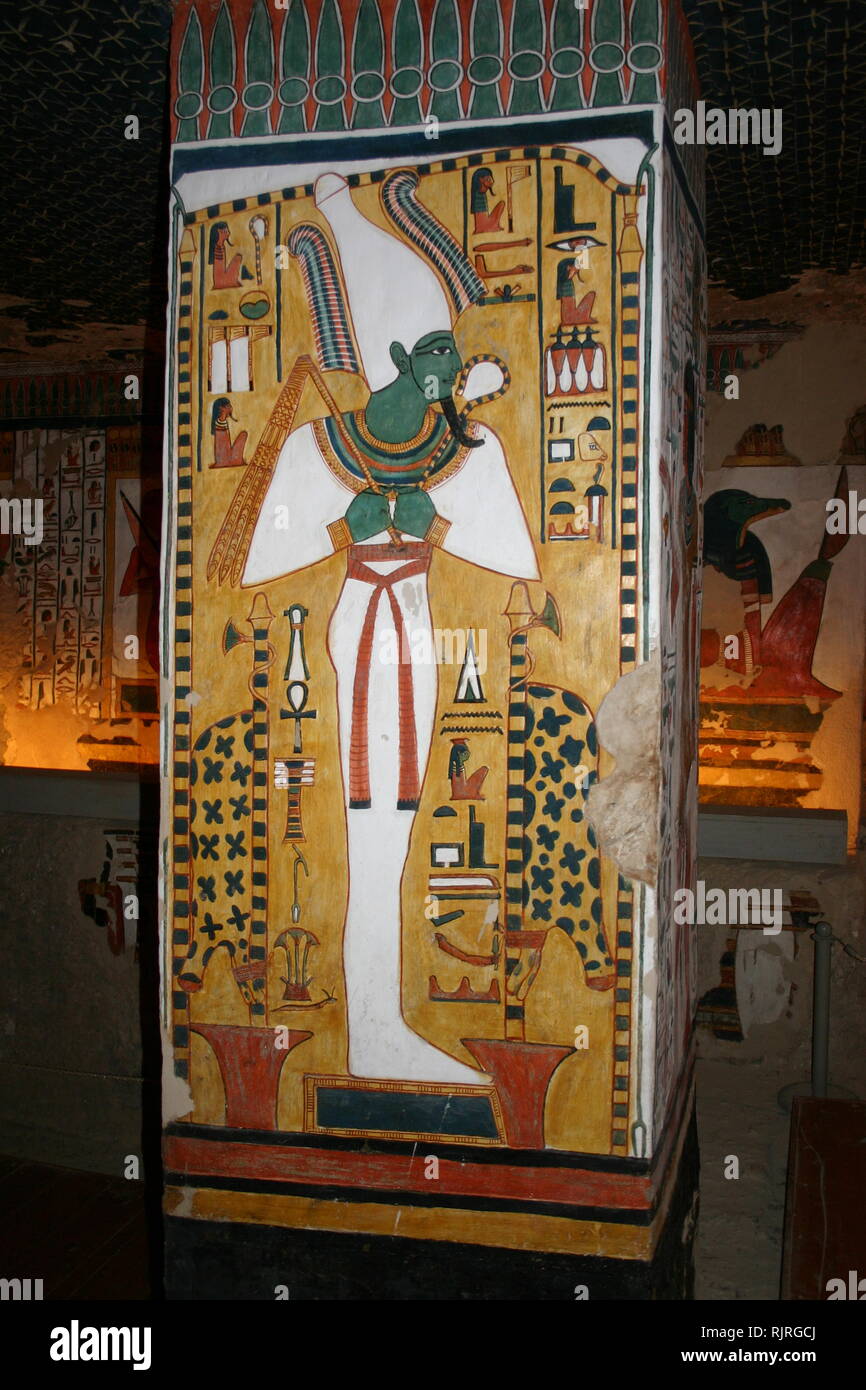 Wall painting showing, Osiris, the god of the afterlife, underworld, and rebirth, in ancient Egyptian religion. Inside the tomb (QV66) of Nefertari, in Egypt's Valley of the Queens. It was discovered by Ernesto Schiaparelli in 1904. It is called the Sistine Chapel of Ancient Egypt. In the Valley of the Queens, Nefertari's tomb once held the mummified body and representative symbolisms of her, like what most Egyptian tombs consisted of. Now, everything had been looted except for two thirds of the 5,200 square feet of wall paintings. ca. 1255 BC Stock Photo