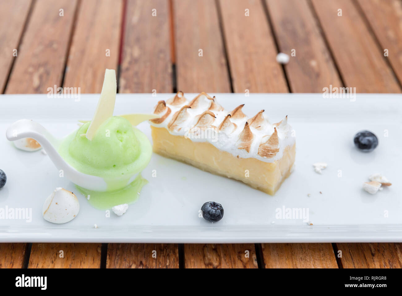Dessert - Cheesecake with lime sherbet ice cream Stock Photo