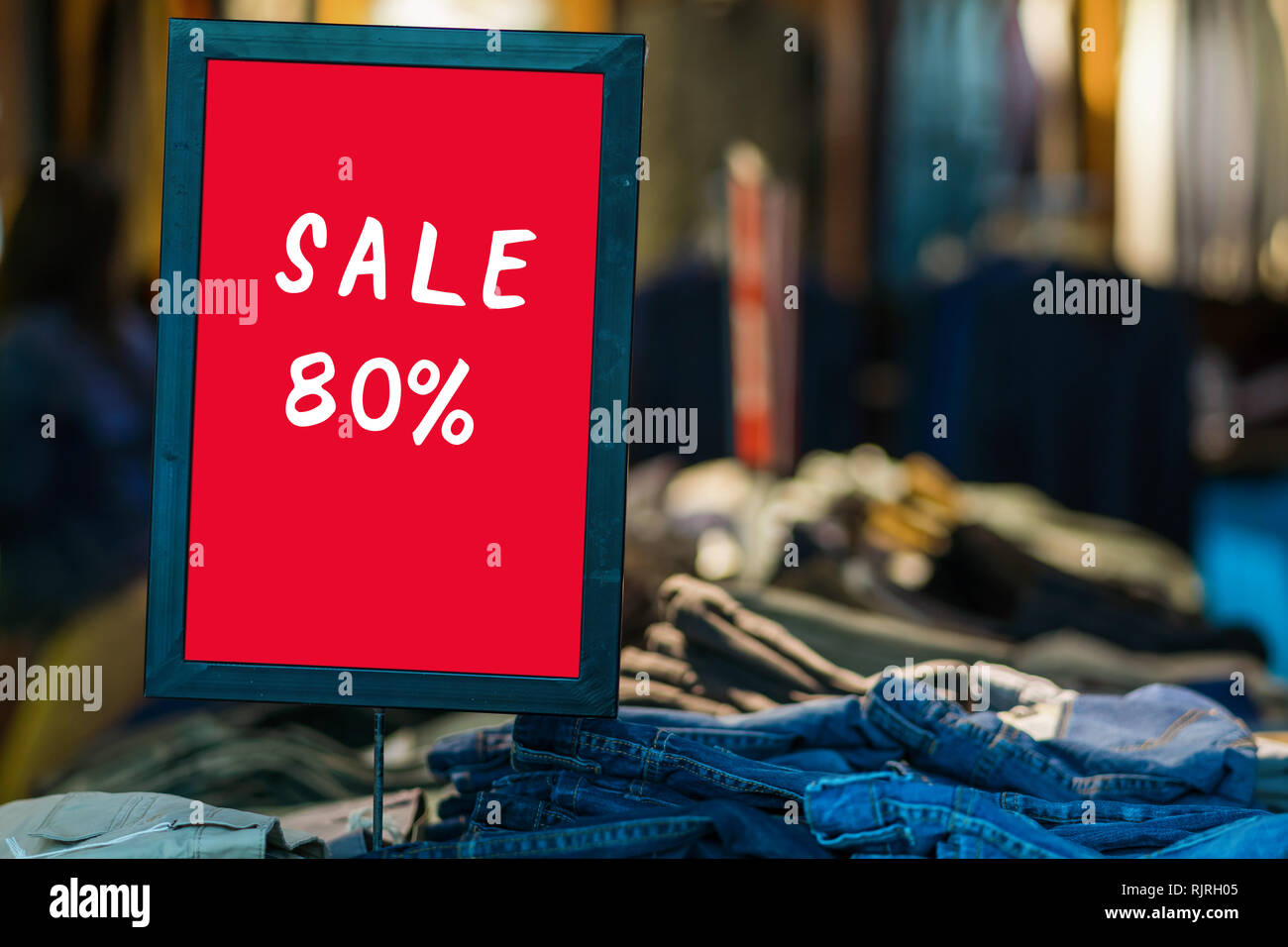 sale 80 off mock up advertise display frame setting over the bucket jeans in the shopping department store for shopping, business fashion and advertis Stock Photo