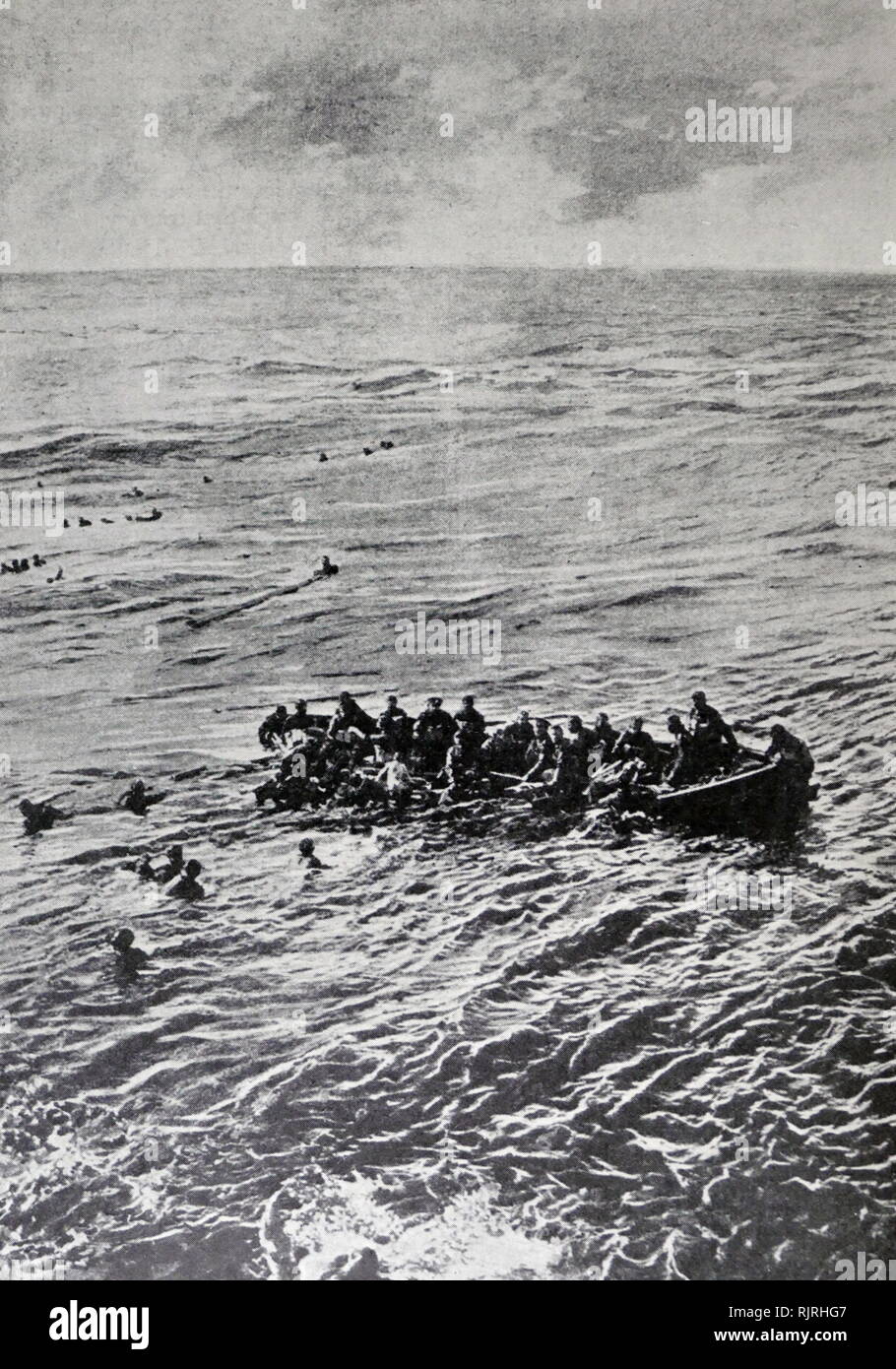 The Ivernia was a Cunard liner employed during World War One, on transport service. She was sunk in the Mediterranean on New Year's Day, 1917, by a German submarine. This photograph, taken from the deck of the sinking transport, shows men struggling in the water and one of the lifeboats about to founder. About one hundred and twenty soldiers were lost and thirty-three members Stock Photo
