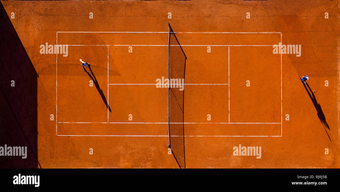 Aerial view of a tennis court with two players who are playing a match Stock Photo Alamy