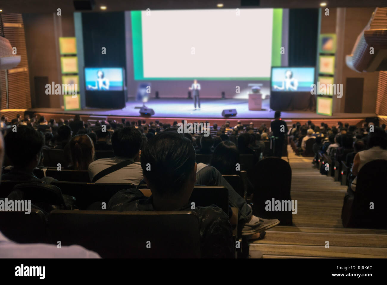 Rear View Of Audience Listening The Speakers On The Stage In The Conference Hall Or Seminar Meeting With Low Light Situation Business And Education A Stock Photo Alamy