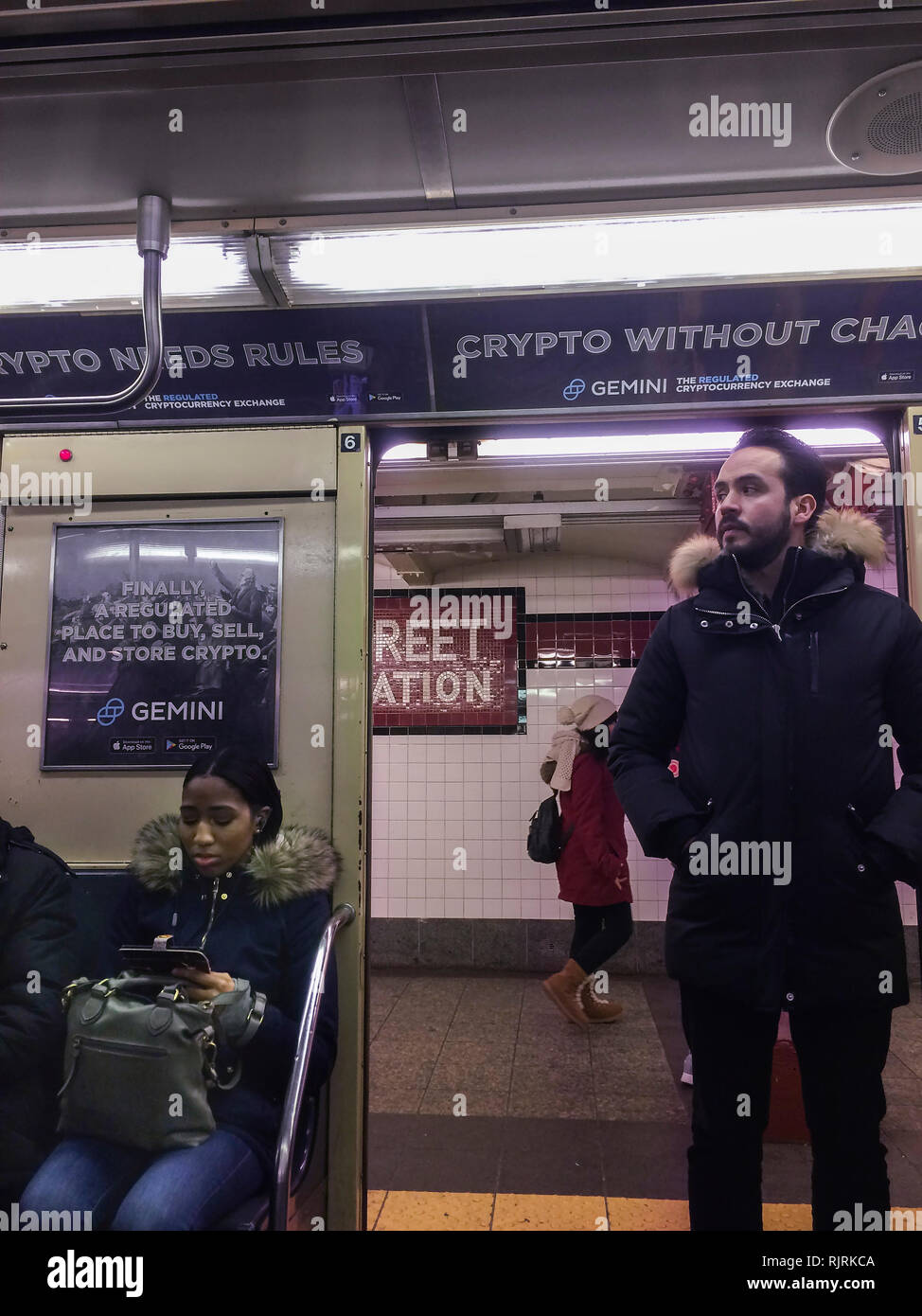 Advertising for the Winklevoss brothers' Gemini Cryptocurrency Exchange on the subway in New York on Tuesday, January 22, 2019. Twins Cameron and Tyler Winklevoss founded the exchange in 2015 trading Bitcoin and other cryptocurrencies.  (Â© Frances M. Roberts) Stock Photo