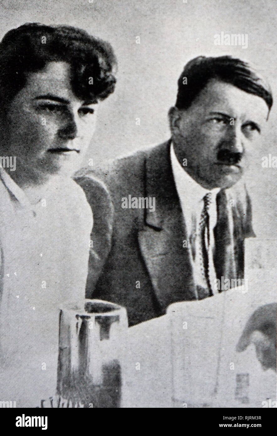 Adolf Hitler (1889 - 1945); leader of the Nazi Party with Angela Maria 'Geli' Raubal (1908 - 1931); Adolf Hitler's half-niece. Born in Linz, Austria-Hungary, she was the second child and eldest daughter of Leo Raubal Sr. and Hitler's half-sister, Angela Raubal. Raubal lived in close contact to her uncle from 1925 until her presumed suicide in 1931. Stock Photo