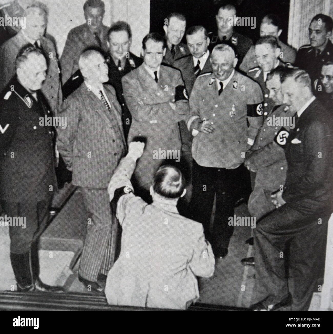 Adolf Hitler German chancellor 1933 - 1945 (seated) with Nazi leaders including Rudolf Hess, Robert Ley and Martin Bormann 1936 Stock Photo