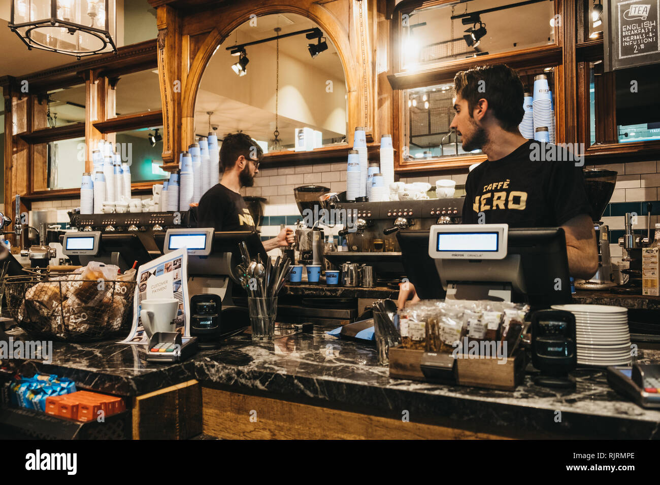 London, UK - January 26, 2019: Staff working behind the counter in Cafe Nero, a British European style coffee house brand headquartered in London, Eng Stock Photo