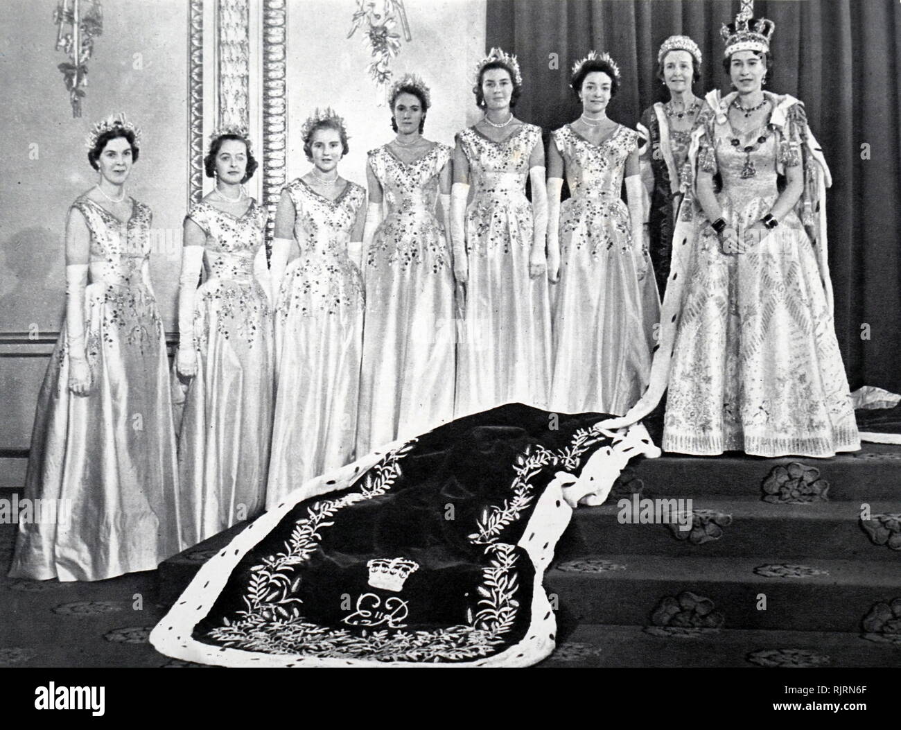 Queen Elizabeth II with her Mistress of the Robes and the six Maids of Honour after her coronation. 1953&#13;&#10; Stock Photo