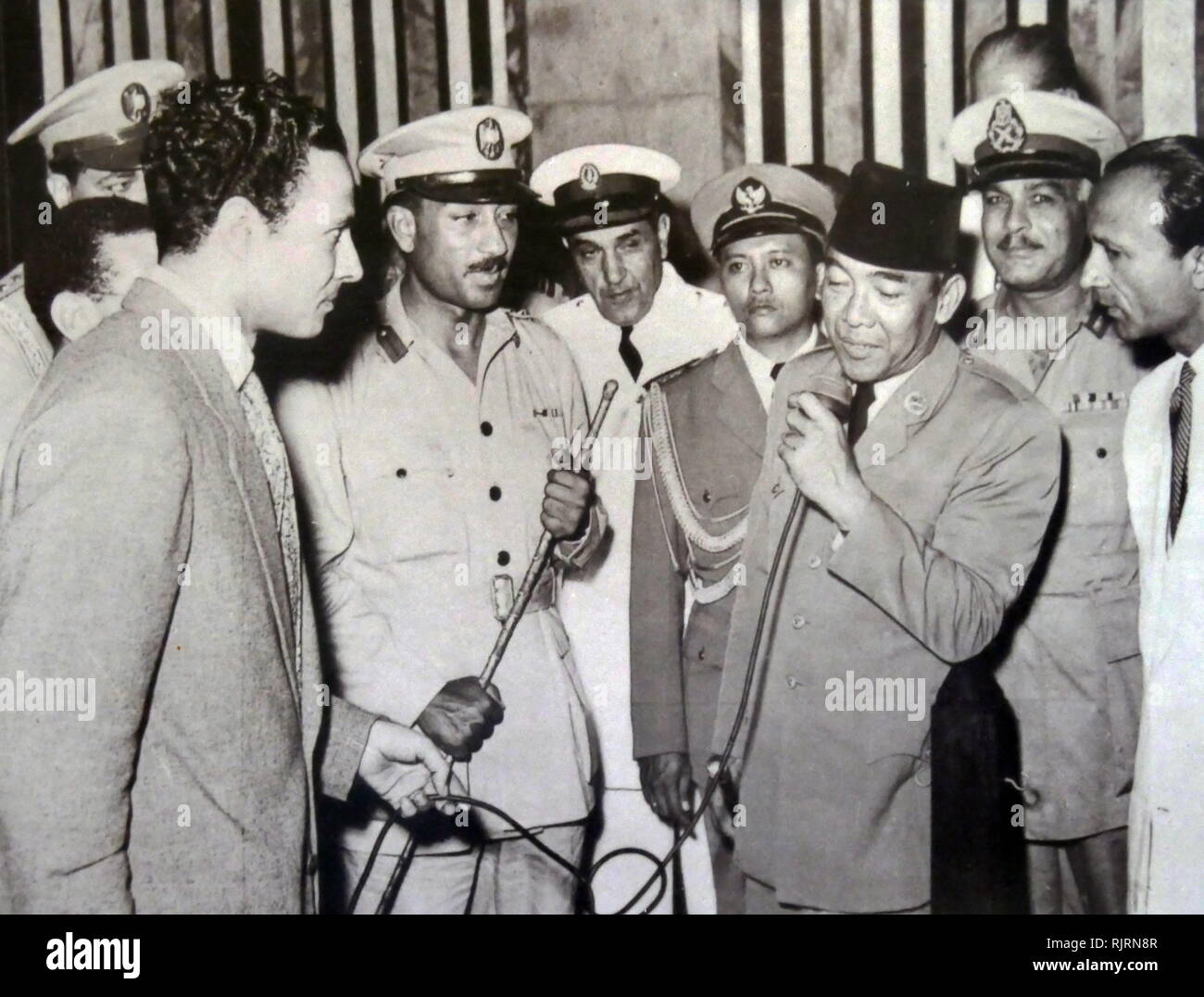 President Ahmed Sukarno of Indonesia with Colonel Anwar Sadat in Egypt. 1955 Stock Photo