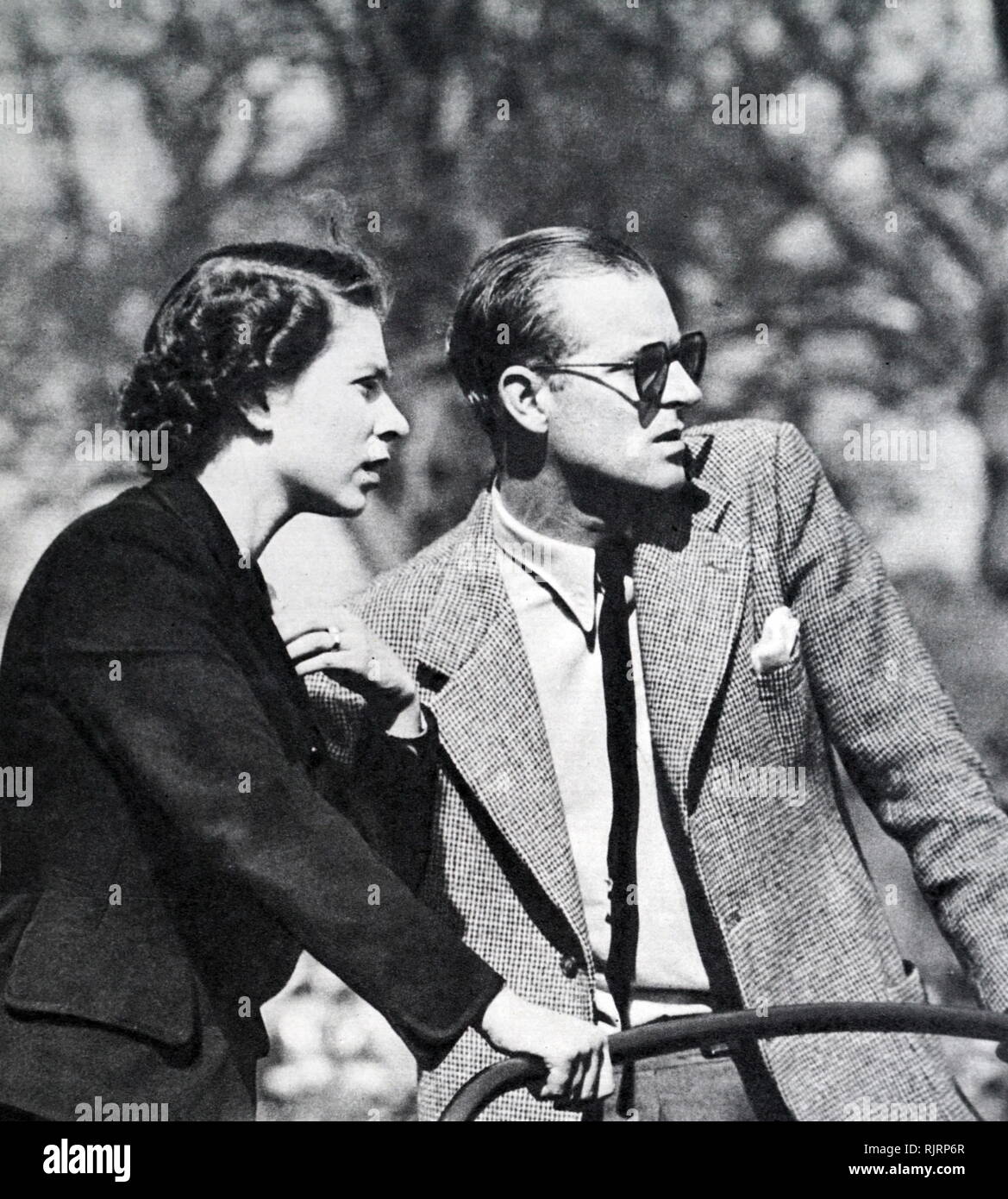 olympic-horse-trials-held-at-badminton-in-1952-queen-elizabeth-ii-and-the-duke-of-edinburgh-watching-the-trials-in-landover-car-RJRP6R.jpg