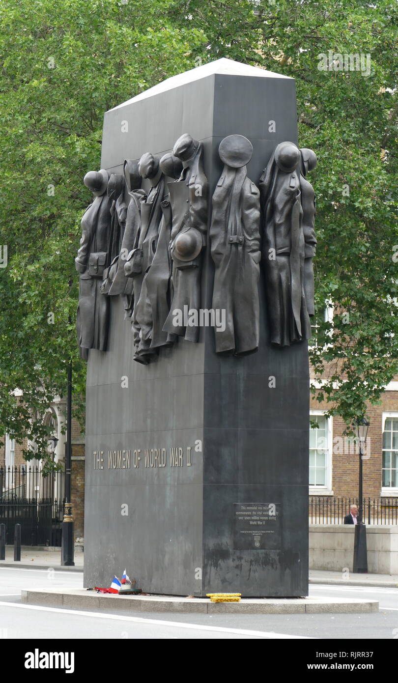 Monument to the Women of World War II is a British national war memorial situated on Whitehall in London, to the north of the Cenotaph. It was sculpted by John W. Mills, unveiled by Queen Elizabeth II and dedicated by Baroness Boothroyd in July 2005 Stock Photo