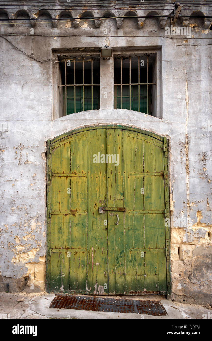 rustic green wooden doors in Valletta, Malta at Victoria Gate entrance to the city. Stock Photo