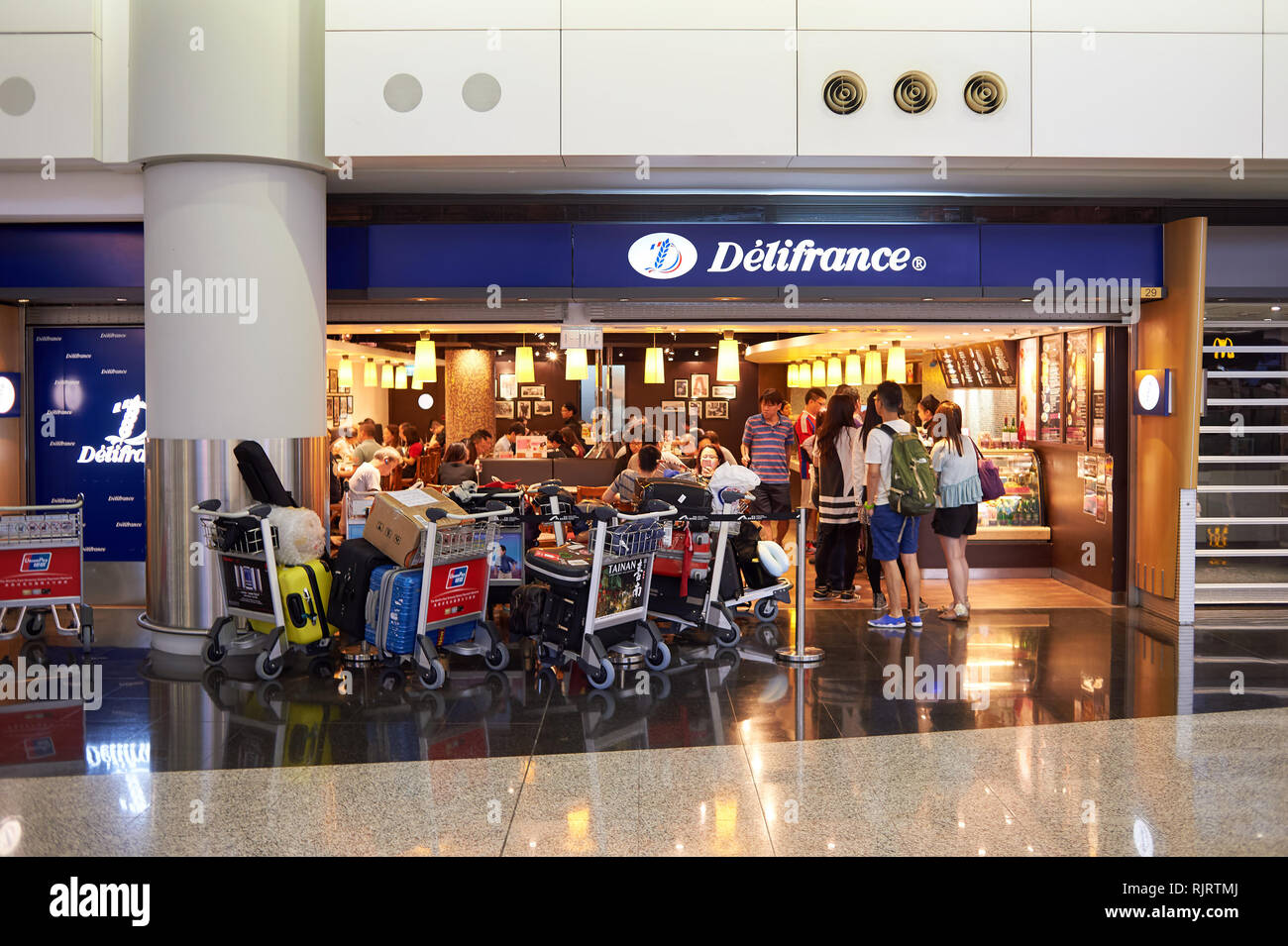 HONG KONG - MAY 06, 2015: Delifrance cafe at Hong Kong Airport. Hong Kong International Airport is the main airport in Hong Kong. It is located on the Stock Photo
