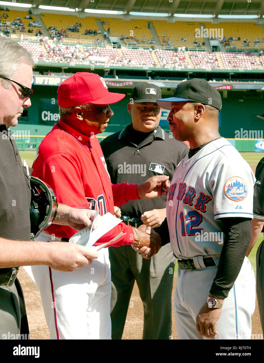 In this April 14, 2005, file photo, Washington Nationals manager Frank  Robinson tips his hat to the crowd as he is introduced during their home  opener against the Arizona Diamondbacks, at RFK