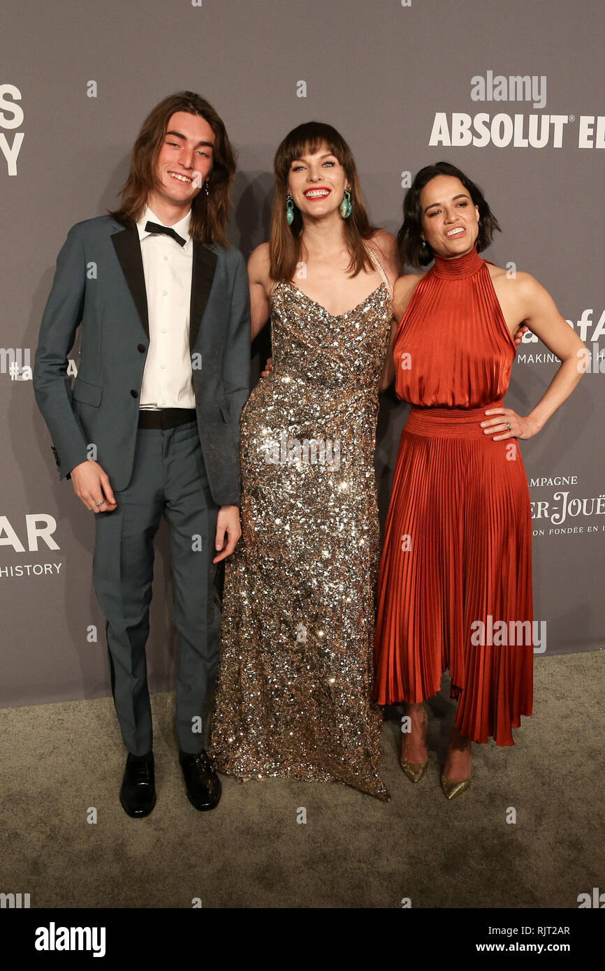 New York, NY, USA. 6th Feb, 2019. 06 February 2019 - New York, NY - Niko  Traubman, Milla Jovovich, Michelle Rodriguez. 21st Annual amfAR Gala New  York benefit for AIDS research during