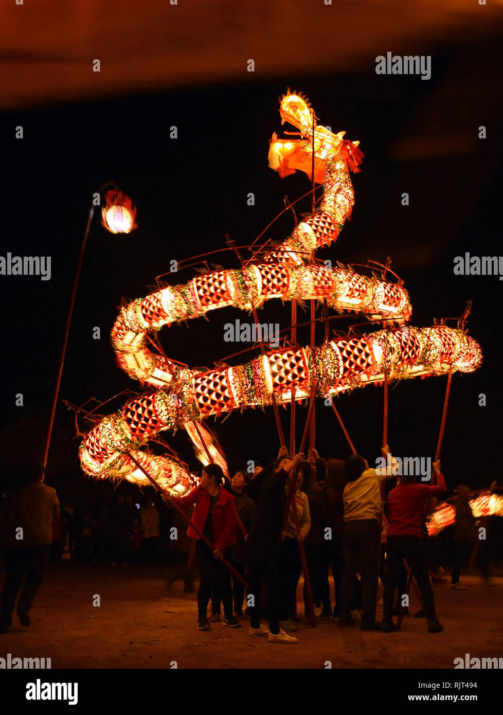 Beijing, China's Hunan Province. 6th Feb, 2019. Villagers perform dragon dance during a parade to celebrate the Chinese Lunar New Year at Xiatuan Village of Chengbu Miao Autonomous County in Shaoyang City, central China's Hunan Province, Feb. 6, 2019. Credit: Yan Qinlong/Xinhua/Alamy Live News Stock Photo