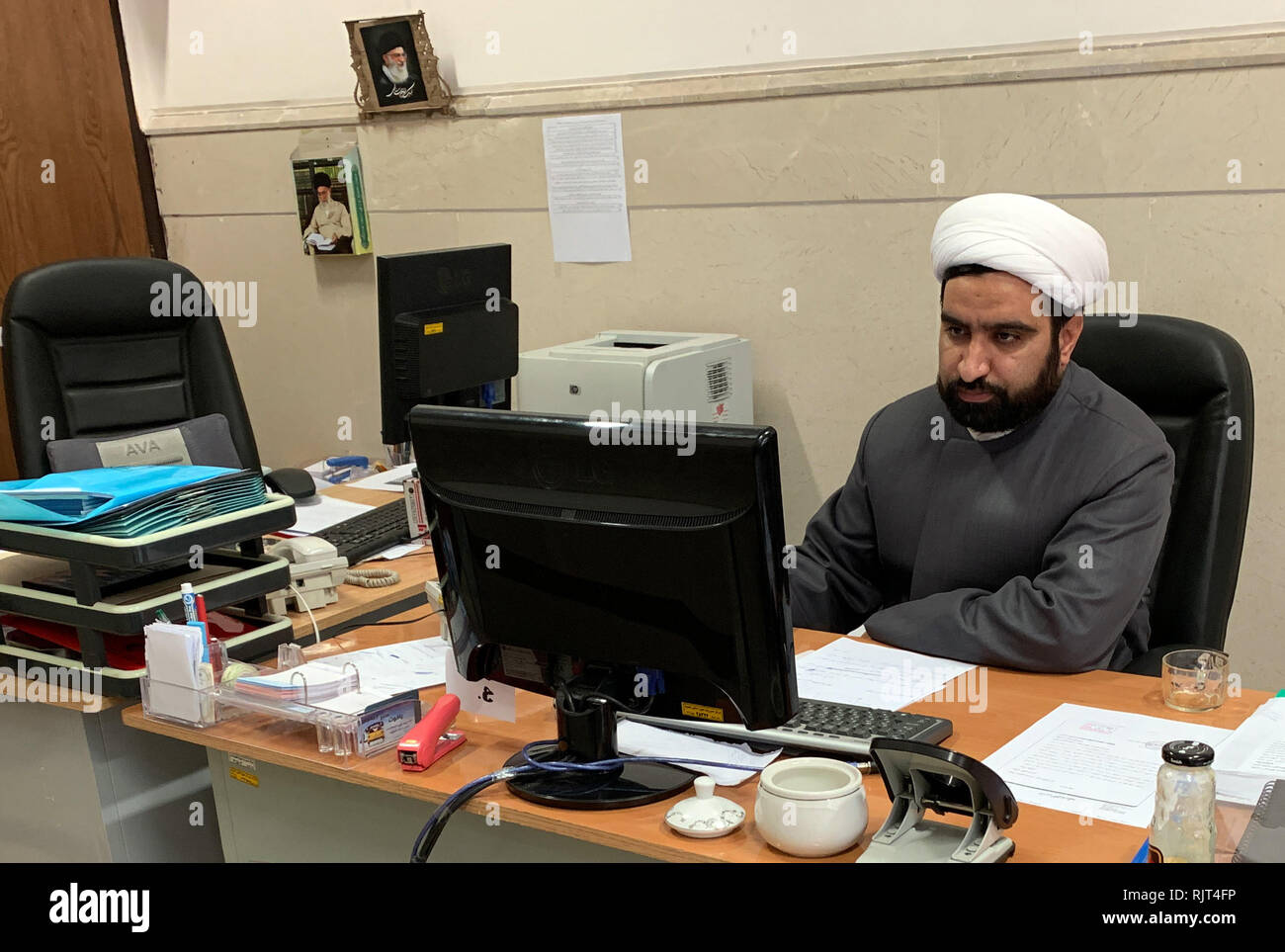 Ghom, Iran. 17th Jan, 2019. An Iranian cleric works on a computer in a Koranic school. Modern technology is also indispensable in the arch-conservative Koran schools in Iran. Where paper and pencil were used a few years ago, clerics and students now work with computers. (to dpa 'Much shadow, little light - Iran's Islamic revolution turns 40' from 08.02.2019) Credit: Farshid Motahari/dpa/Alamy Live News Stock Photo