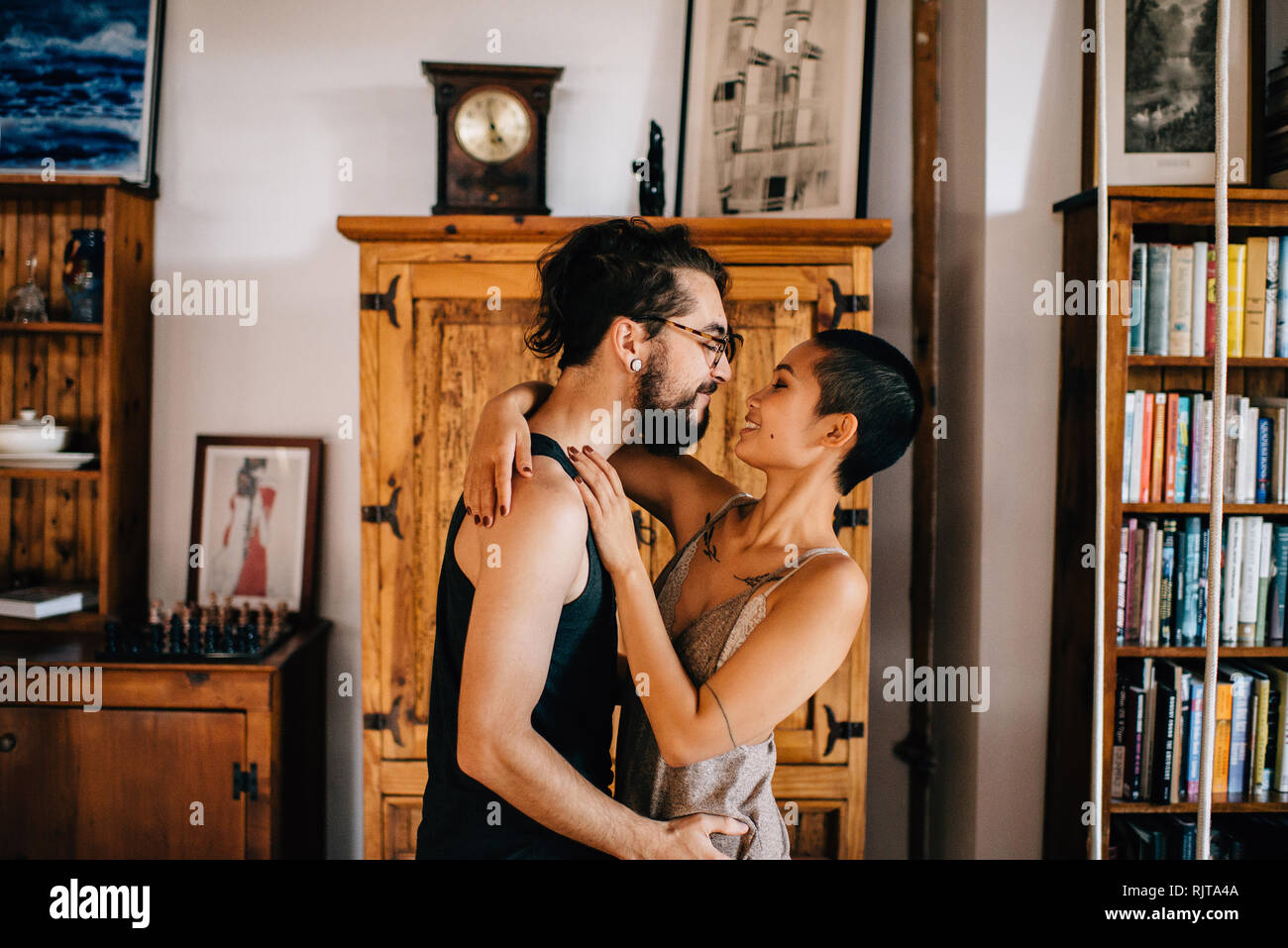 Couple hugging home hi-res stock photography and images - Alamy