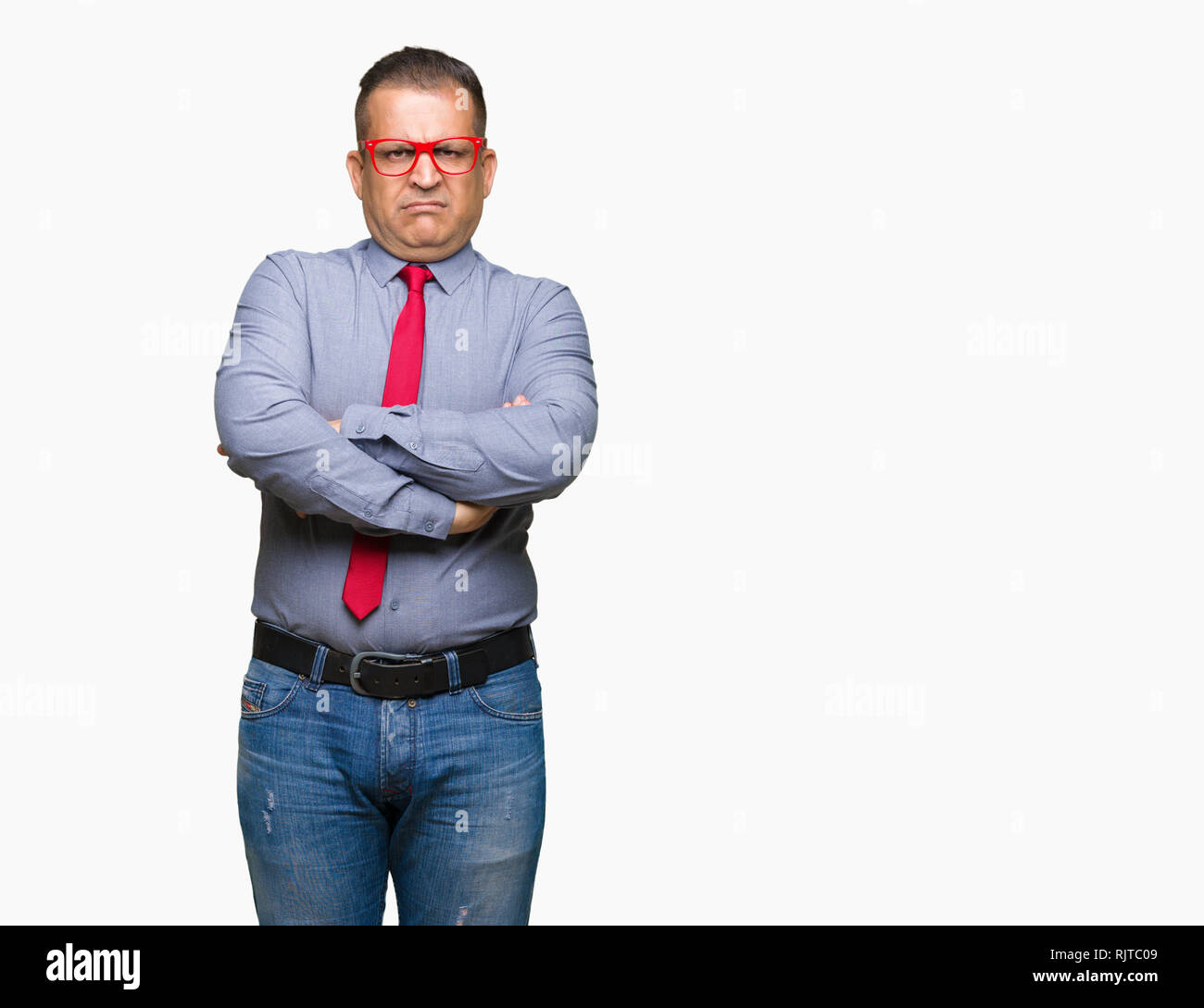 Middle age arab man wearing fashion red glasses over isolated background skeptic and nervous, disapproving expression on face with crossed arms. Negat Stock Photo