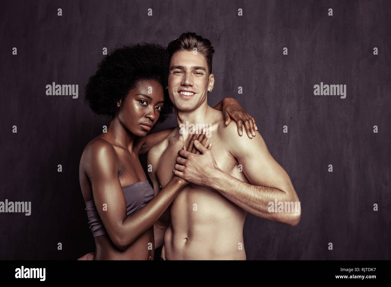 Nice handsome man holding his girlfriends hand Stock Photo