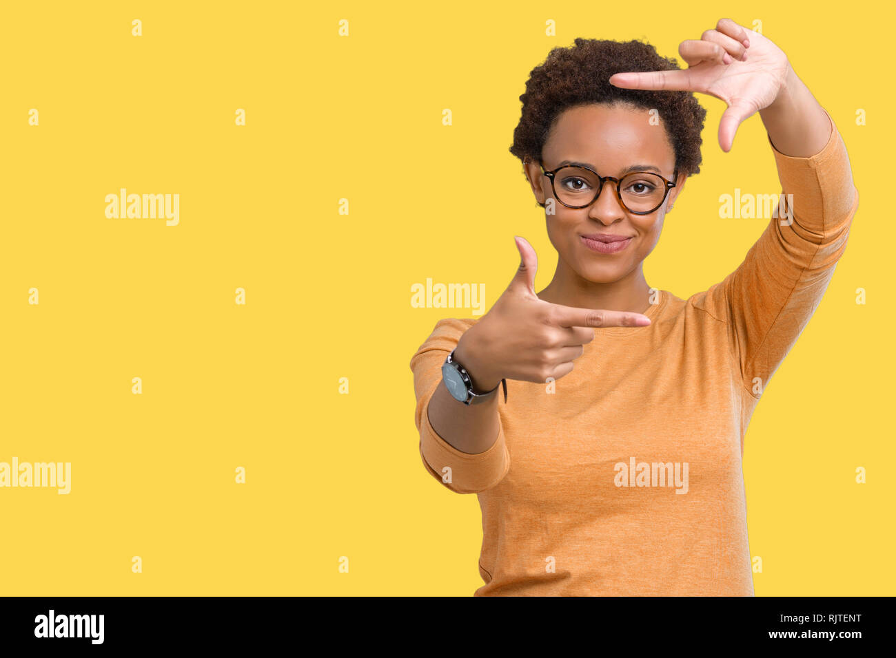 Young beautiful african american woman wearing glasses over isolated ...