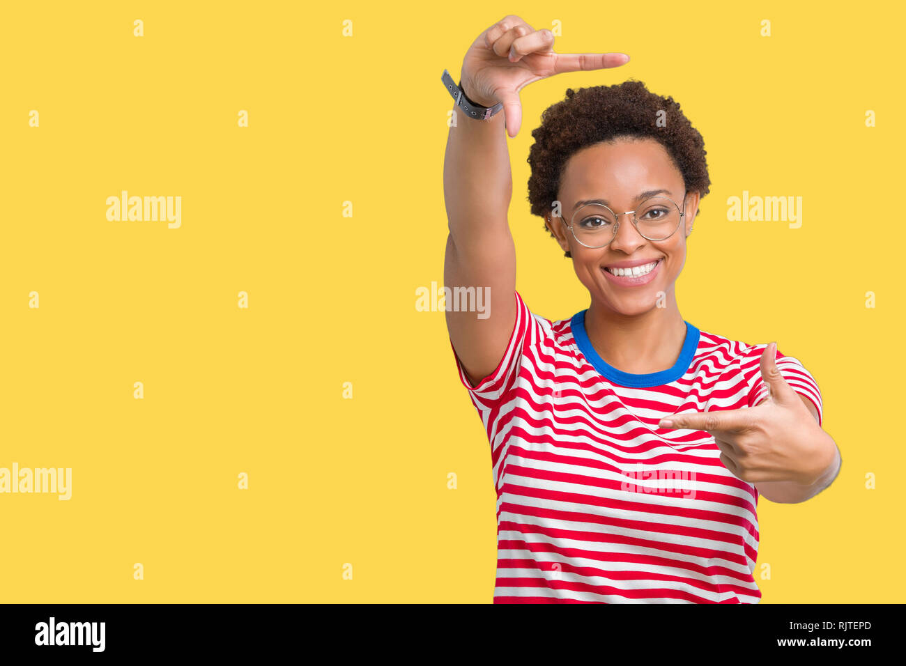Beautiful young african american woman wearing glasses over isolated ...