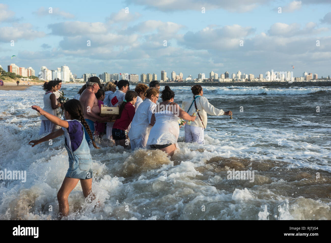 Maldonado, Uruguay - February 2, 2019: Parishioners of the Umbandist church worship Orisha Yemanja (Iemanja) on the Playa Mansa beach in Punta del Est Stock Photo