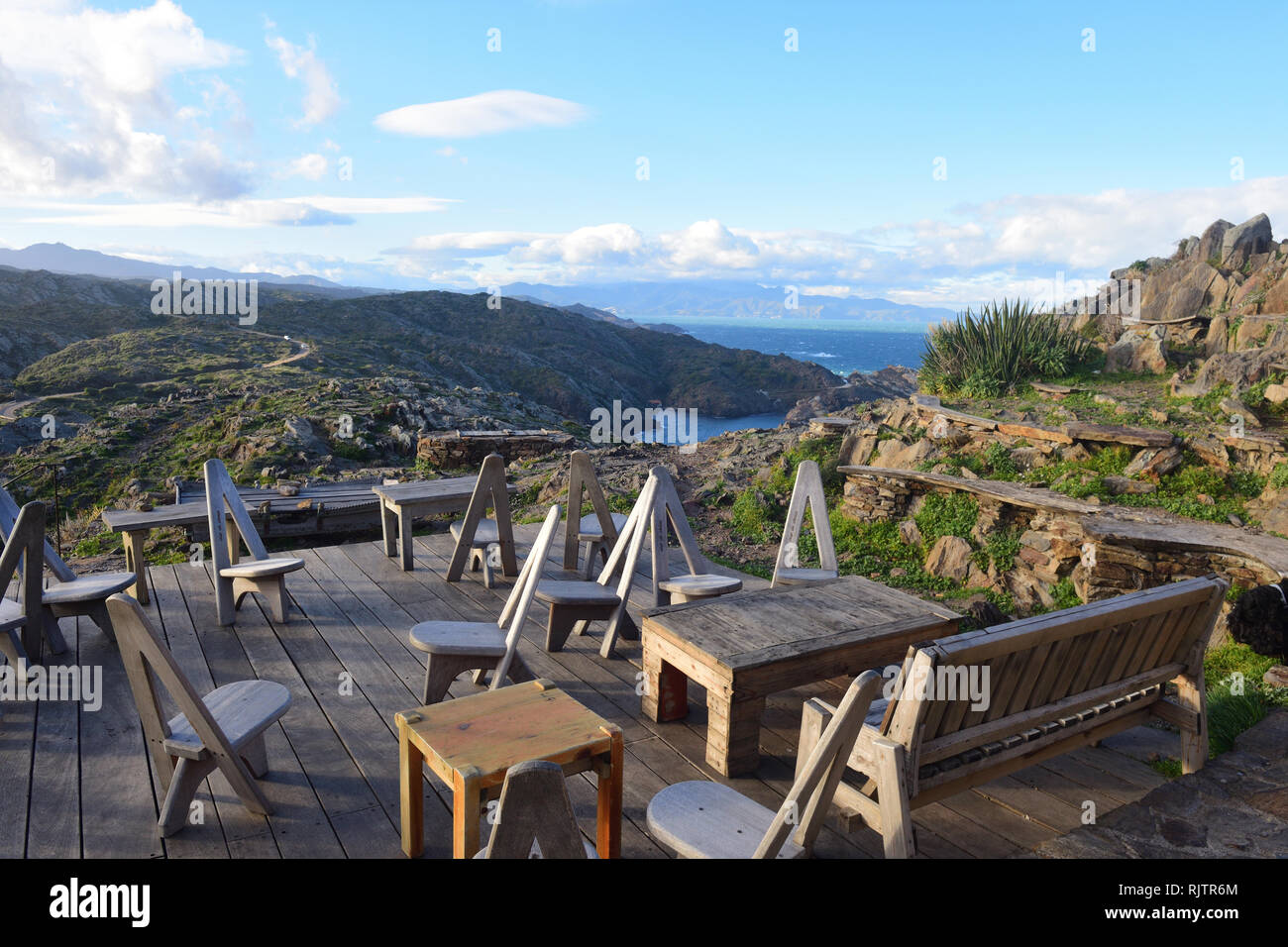 chairs on the terrace of the restaurant of Cap de Creus, Gerona province,Catalonia, Spain (background Cala Culip) Stock Photo