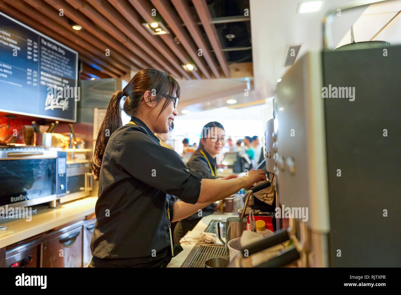 Mccafe Worker Hk style cafe design hi-res stock photography and images - Alamy