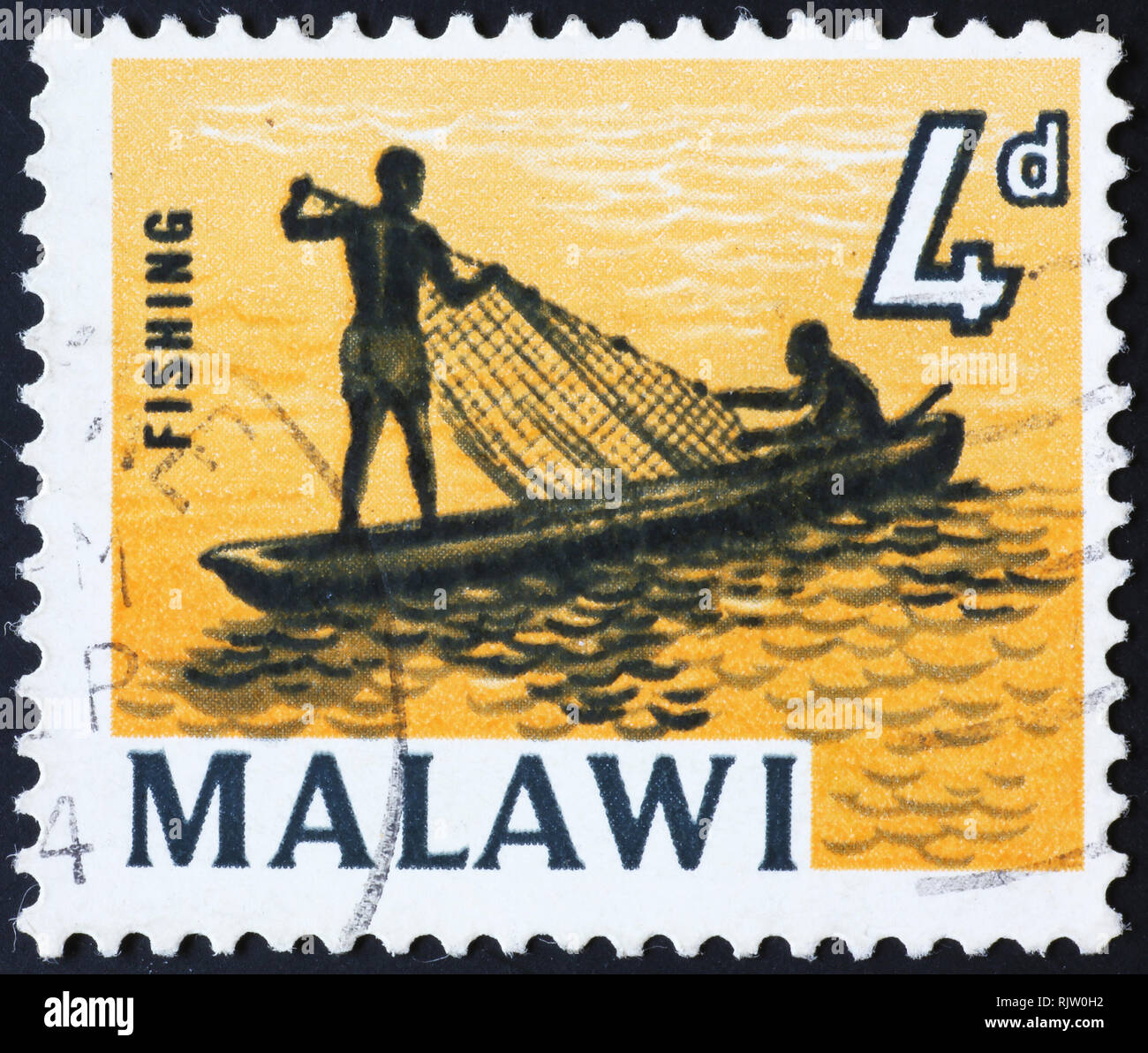 Fishermen on pirague in postage stamp of Malawi Stock Photo