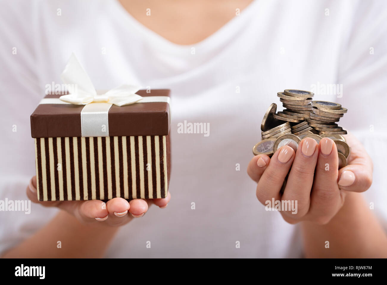 Coin money box hand not piggy bank hires stock photography and images Alamy