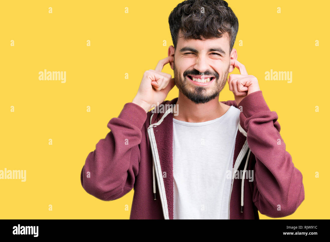 Young Handsome Man Over Isolated Background Covering Ears With Fingers With Annoyed Expression 