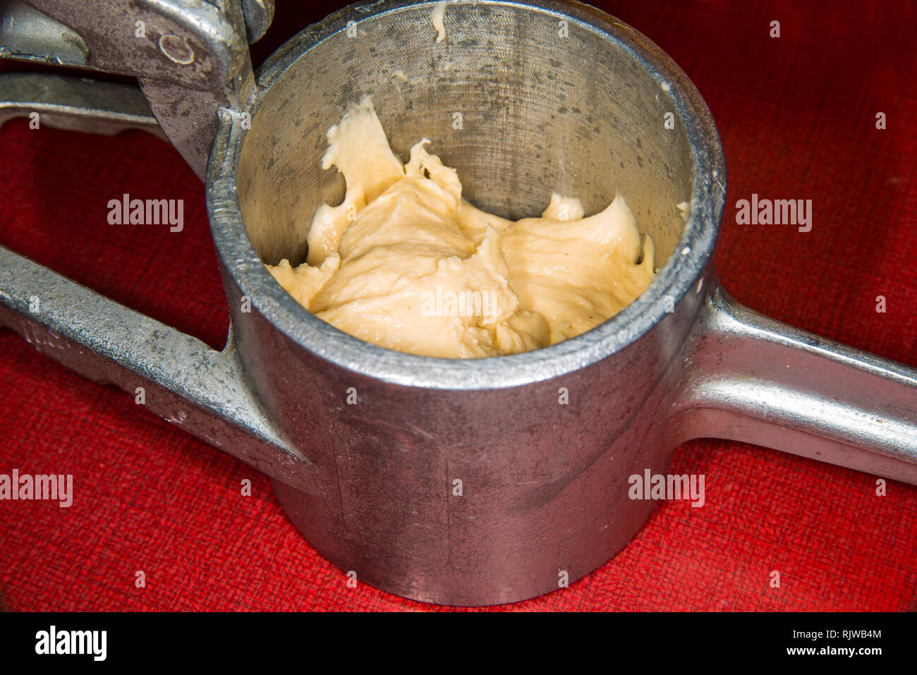 German noodle machine for spaetzle with dough Stock Photo