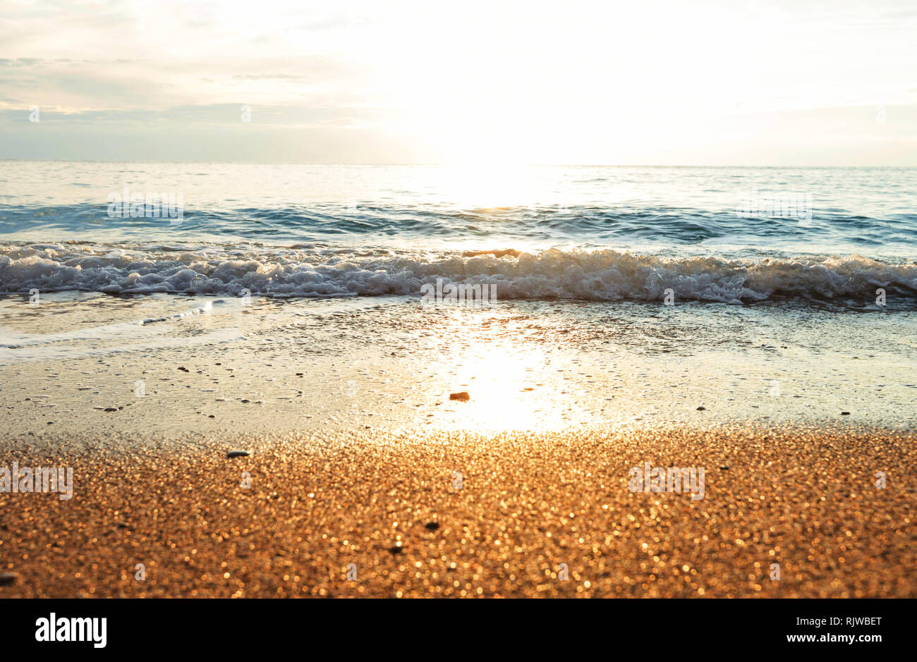 Pibble Wave Beautiful sea wave and pebble at sunset. Amazing holiday and travel ...
