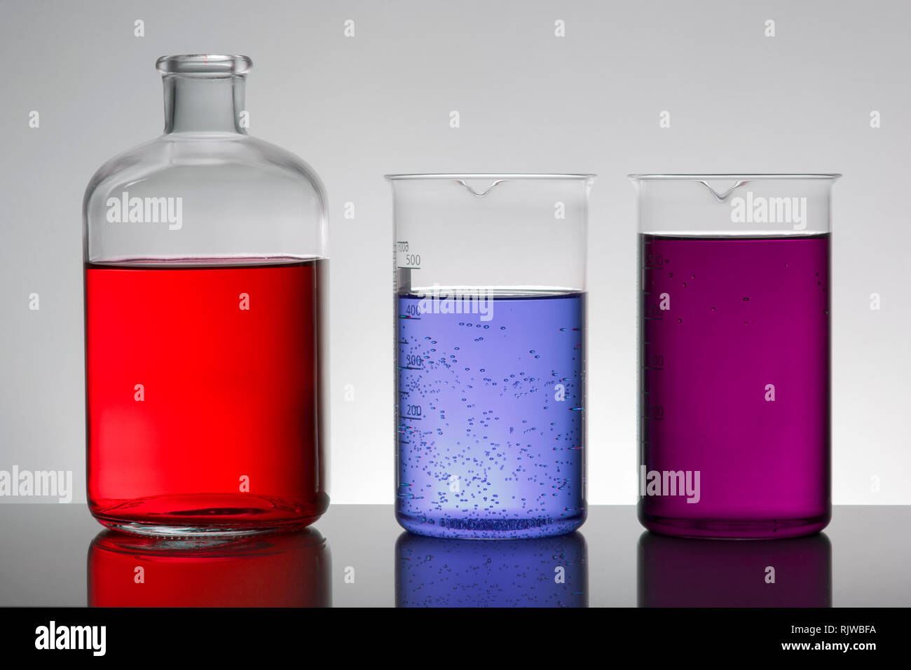 Liquid in laboratory bottles. Scientific biochemical laboratory