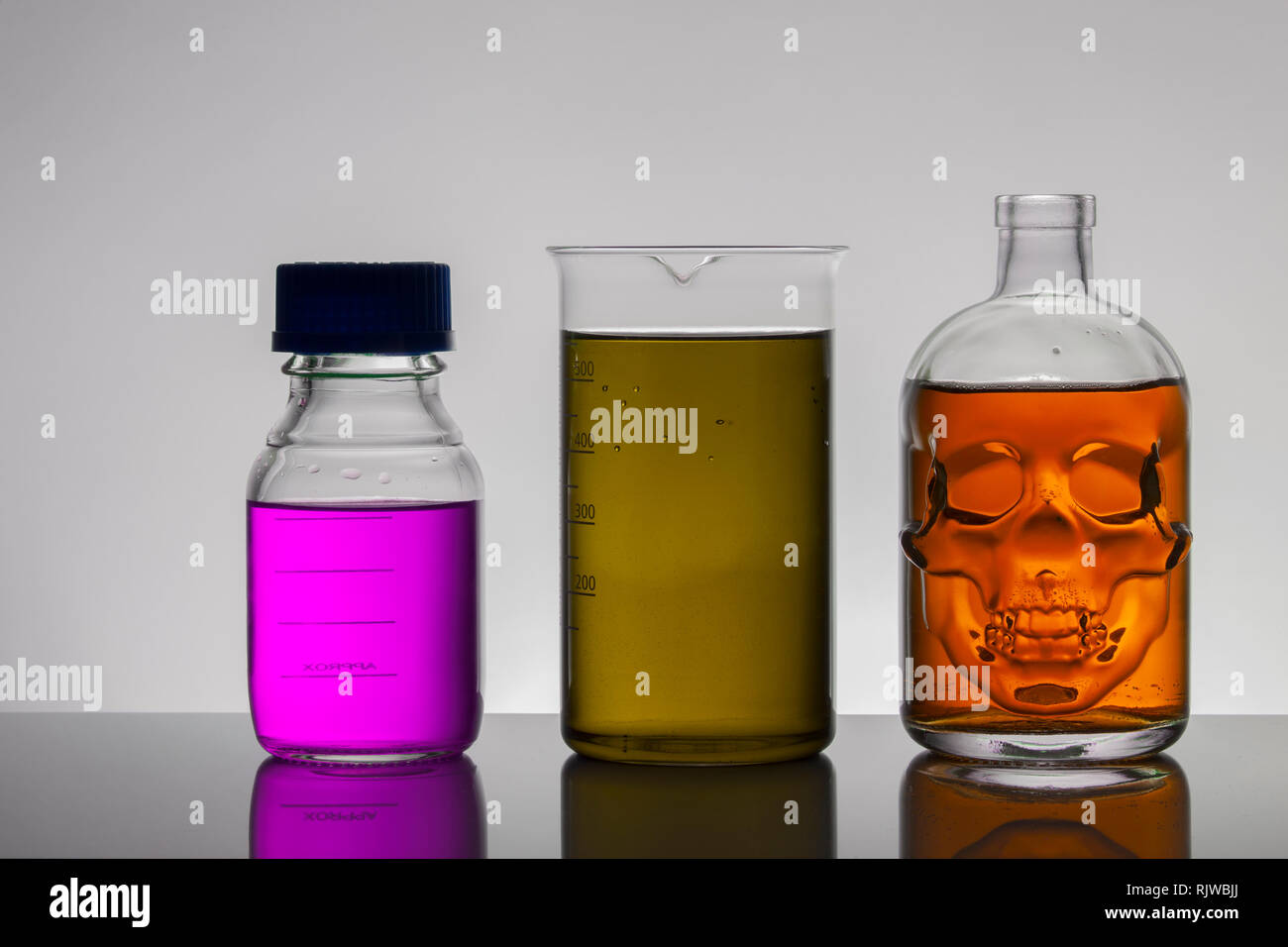 Fluids In Lab Containers Liquid in laboratory bottles. Scientific biochemical laboratory ...