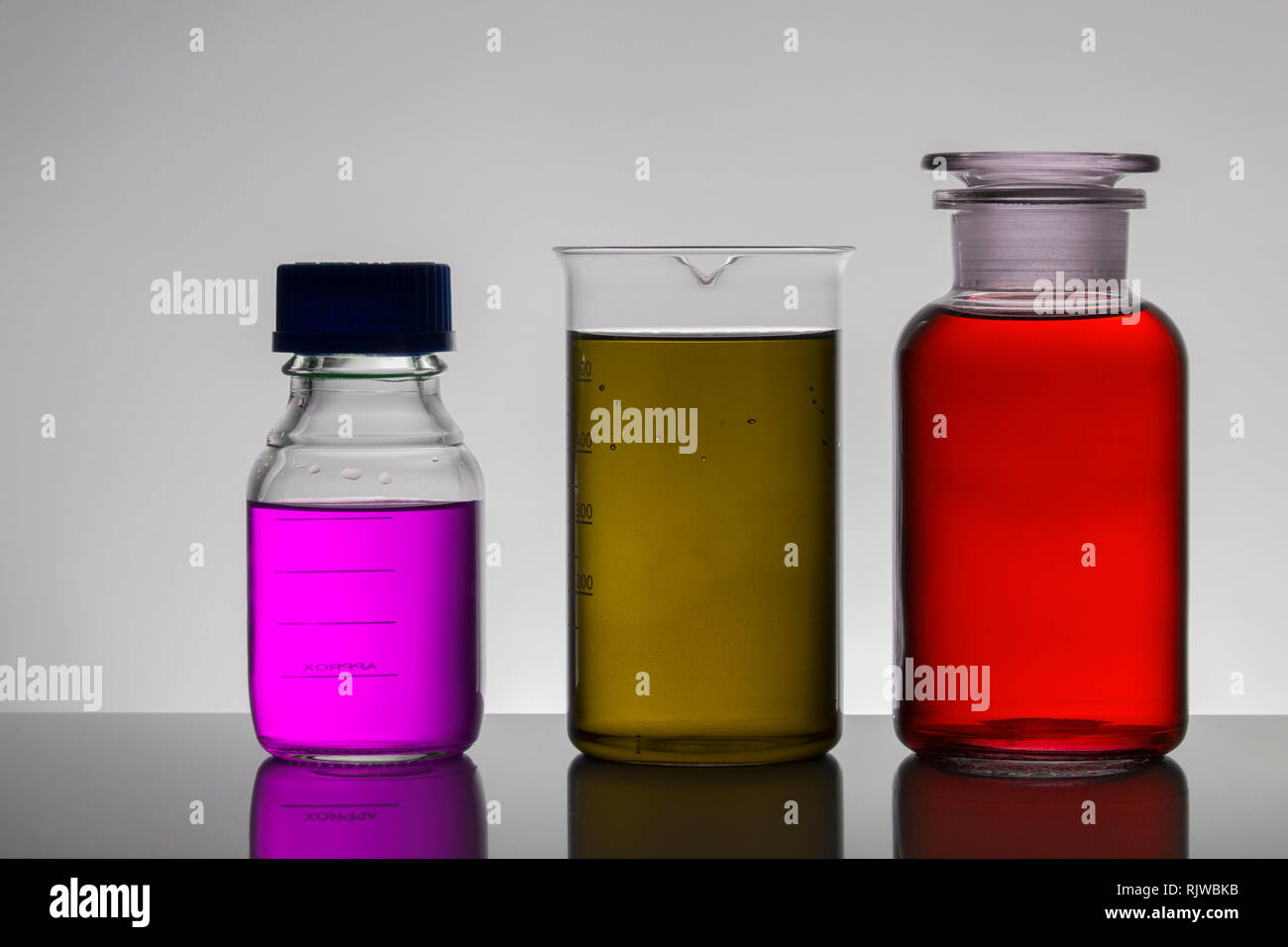 Liquid in laboratory bottles. Scientific biochemical laboratory ...