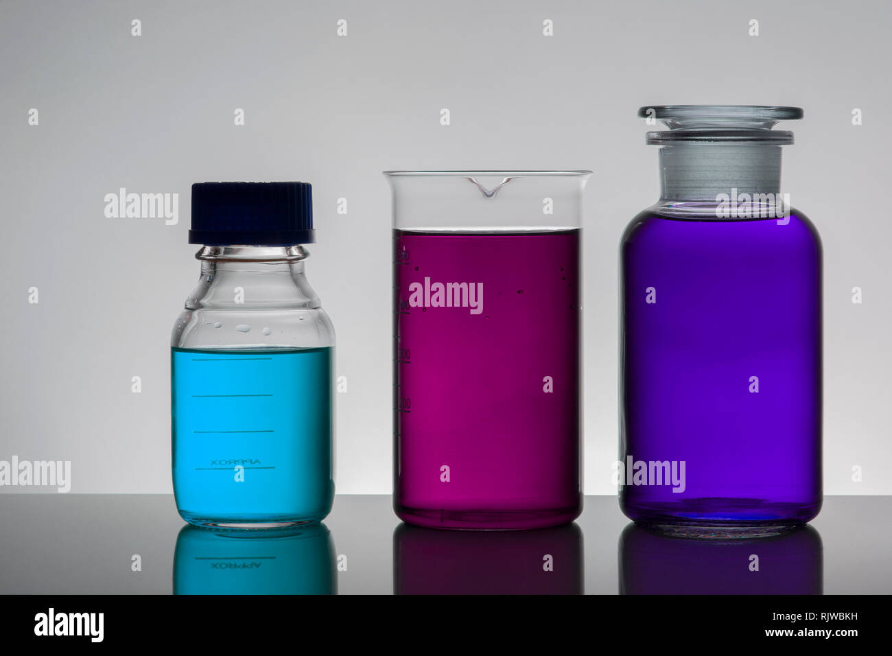 Fluids In Lab Containers Liquid in laboratory bottles. Scientific biochemical laboratory ...