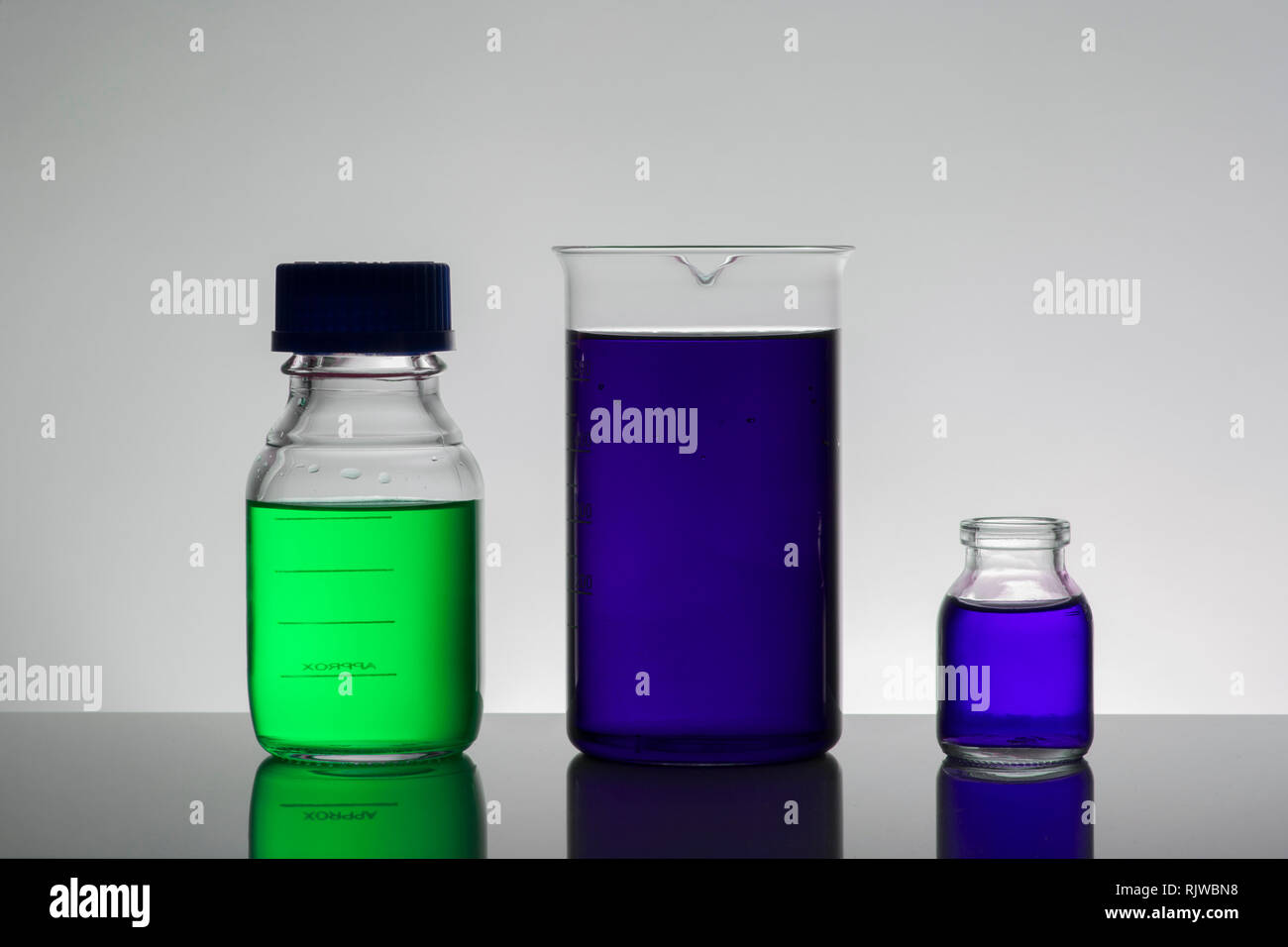 Liquid in laboratory bottles. Scientific biochemical laboratory ...