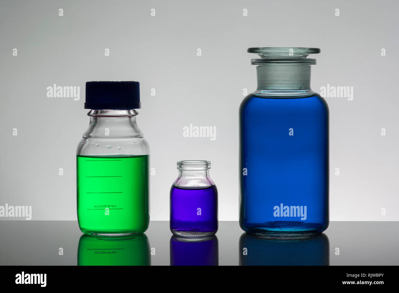 Liquid in laboratory bottles. Scientific biochemical laboratory ...
