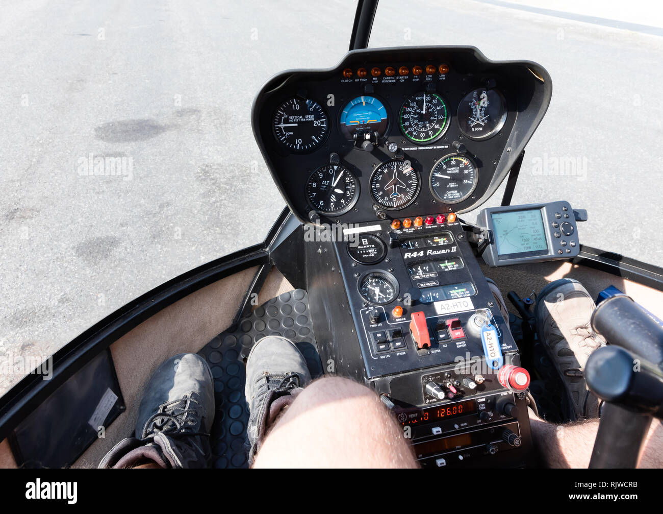 Wide view, a cockpit of a small helicopter, a control panel and a