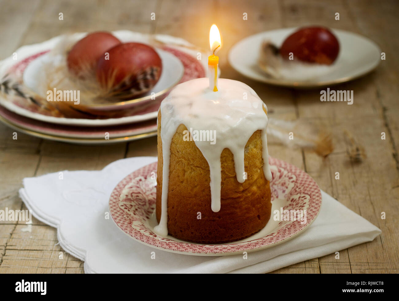 Easter composition with Easter cake and Easter eggs on a wooden background. Rustic style. Stock Photo