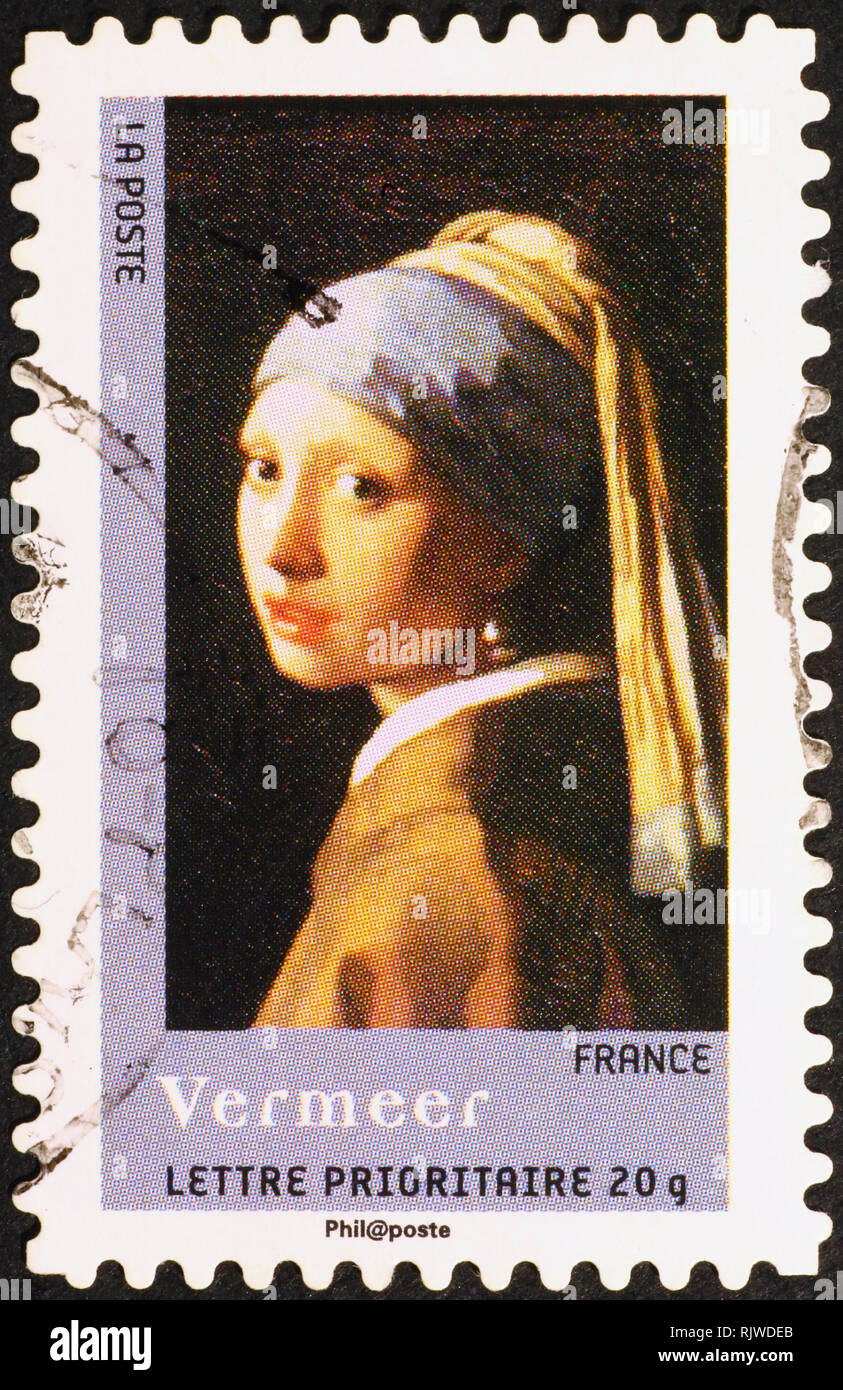 Famous painting by Vermeer on french postage stamp Stock Photo