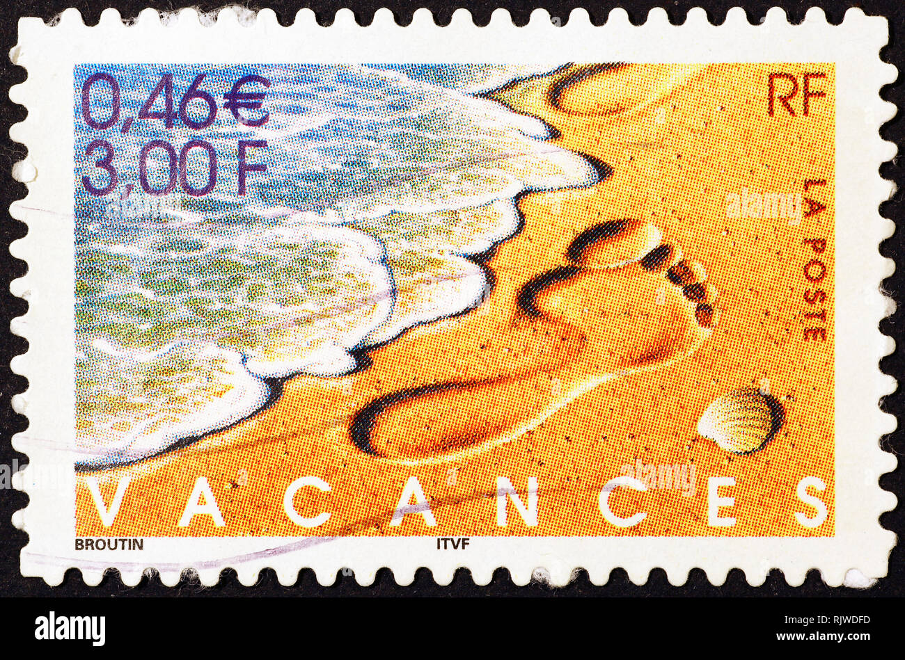 Footprint on beach in french postage stamp Stock Photo Alamy