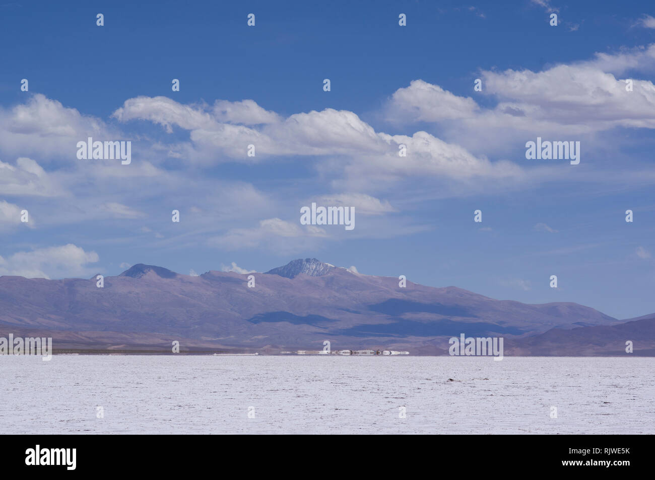 Salinas grandes and salt mining area in northern Argentina, Jujuy region on a sunny day with mountains in the background Stock Photo